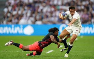 England's Alex Mitchell is tackled by Fiji's Simione Kuruvoli during the Rugby World Cup quarter-final in Marseille on Sunday
