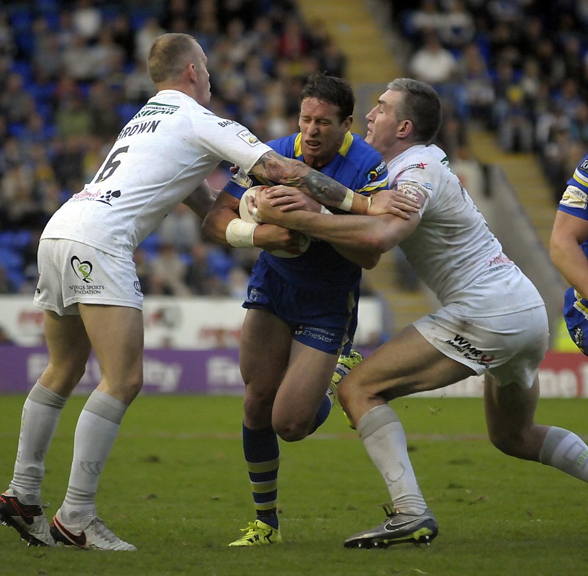 Brown, left, and Chris Houston try to stop Kurt Gidley in 2016's Challenge Cup quarter-final