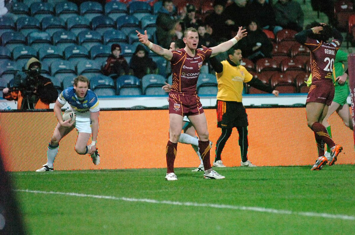 Brown protests as Wolves winger Joel Monaghan crosses for a try in 2012