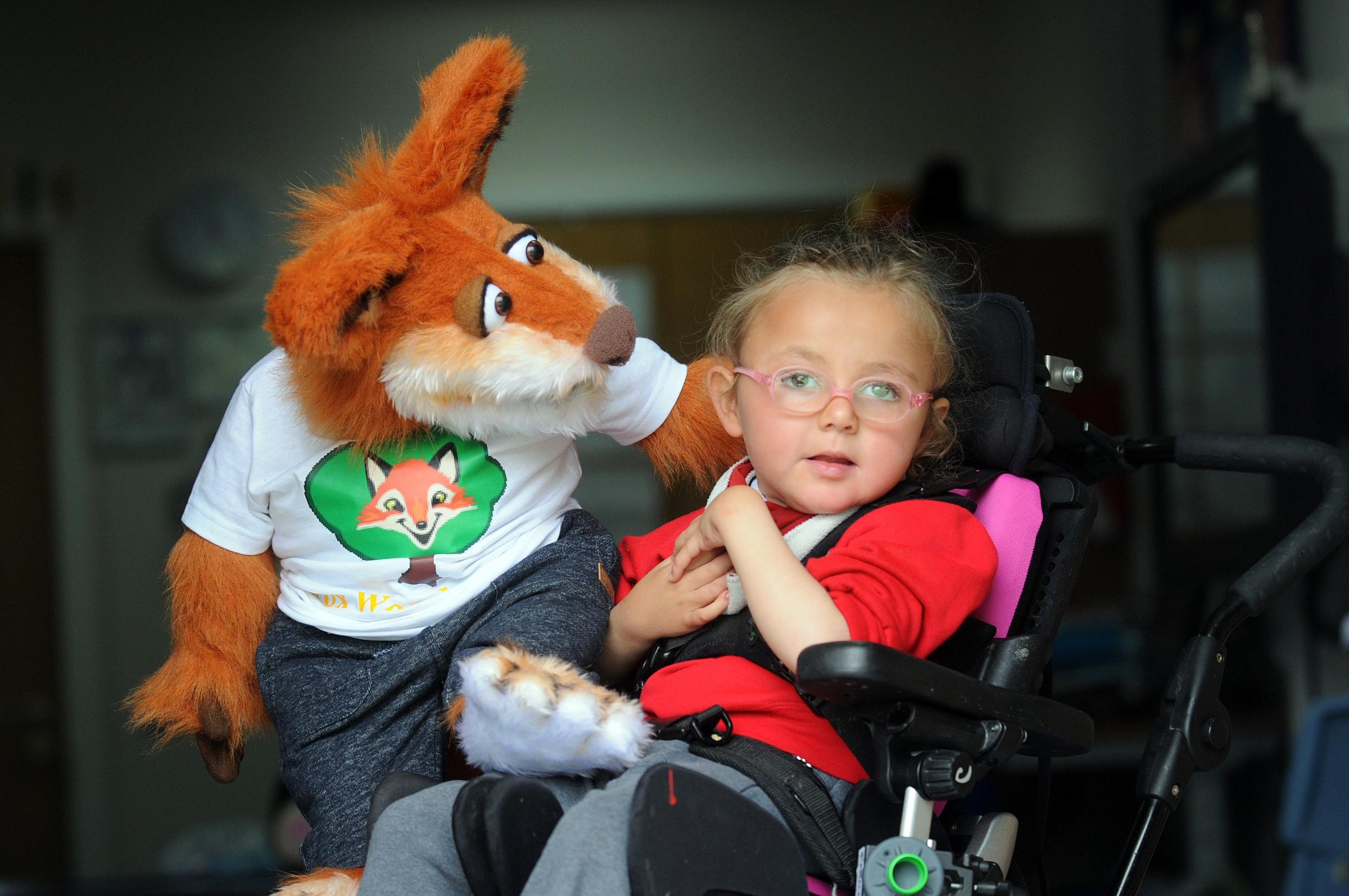 Mum of twin pupils donates fox puppet as mascot for special school