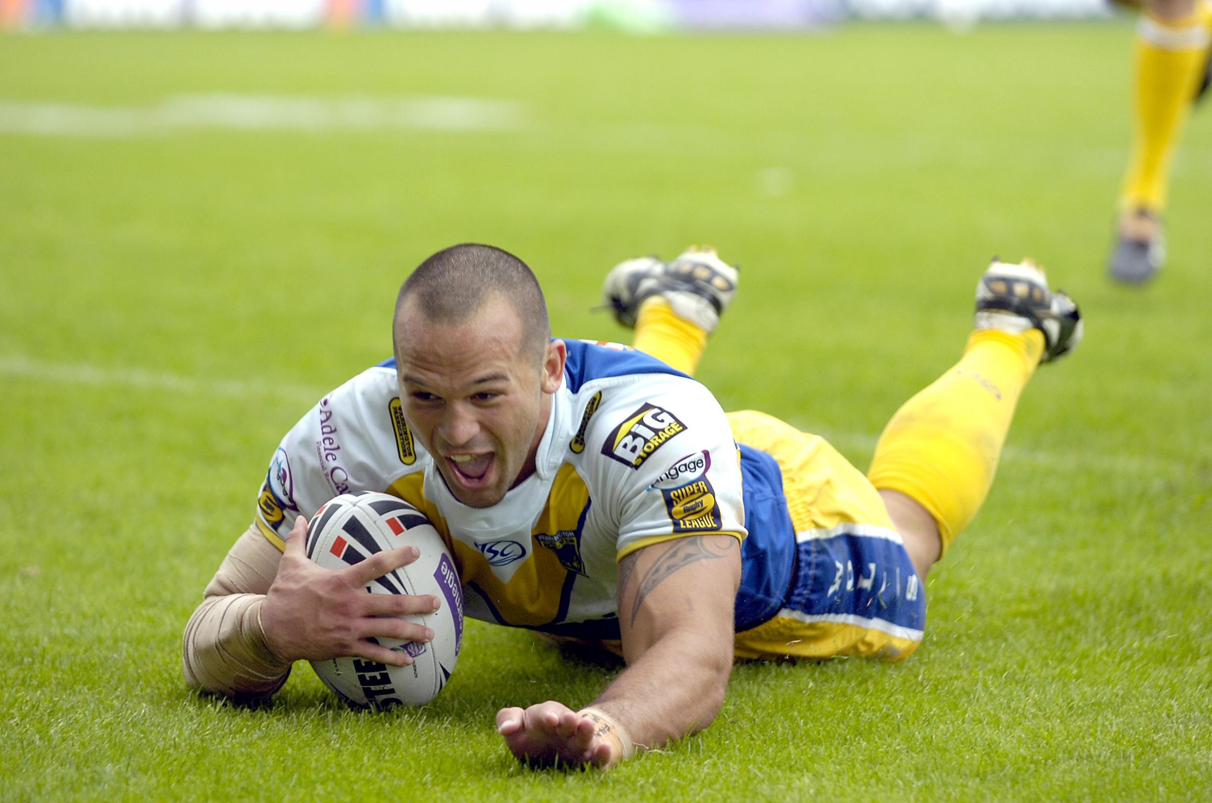 Louis Anderson slides over for one of his three tries against Catalans in 2010. Picture by Mike Boden
