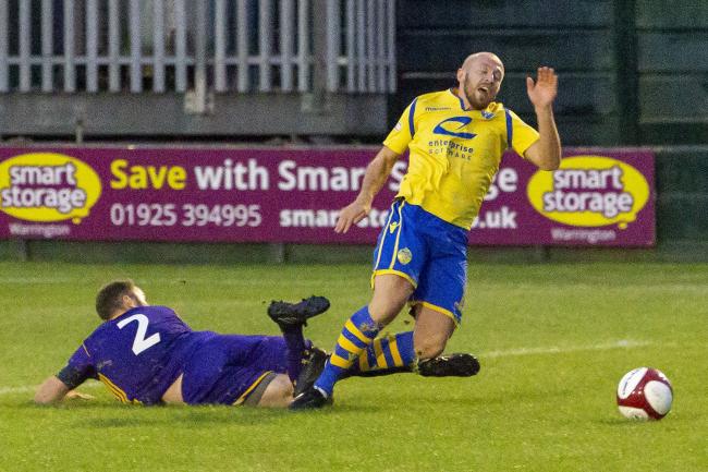 Matthew Chadwick playing as a triallist for Warrington Town against City of Liverpool on Tuesday. Picture: John Hopkins