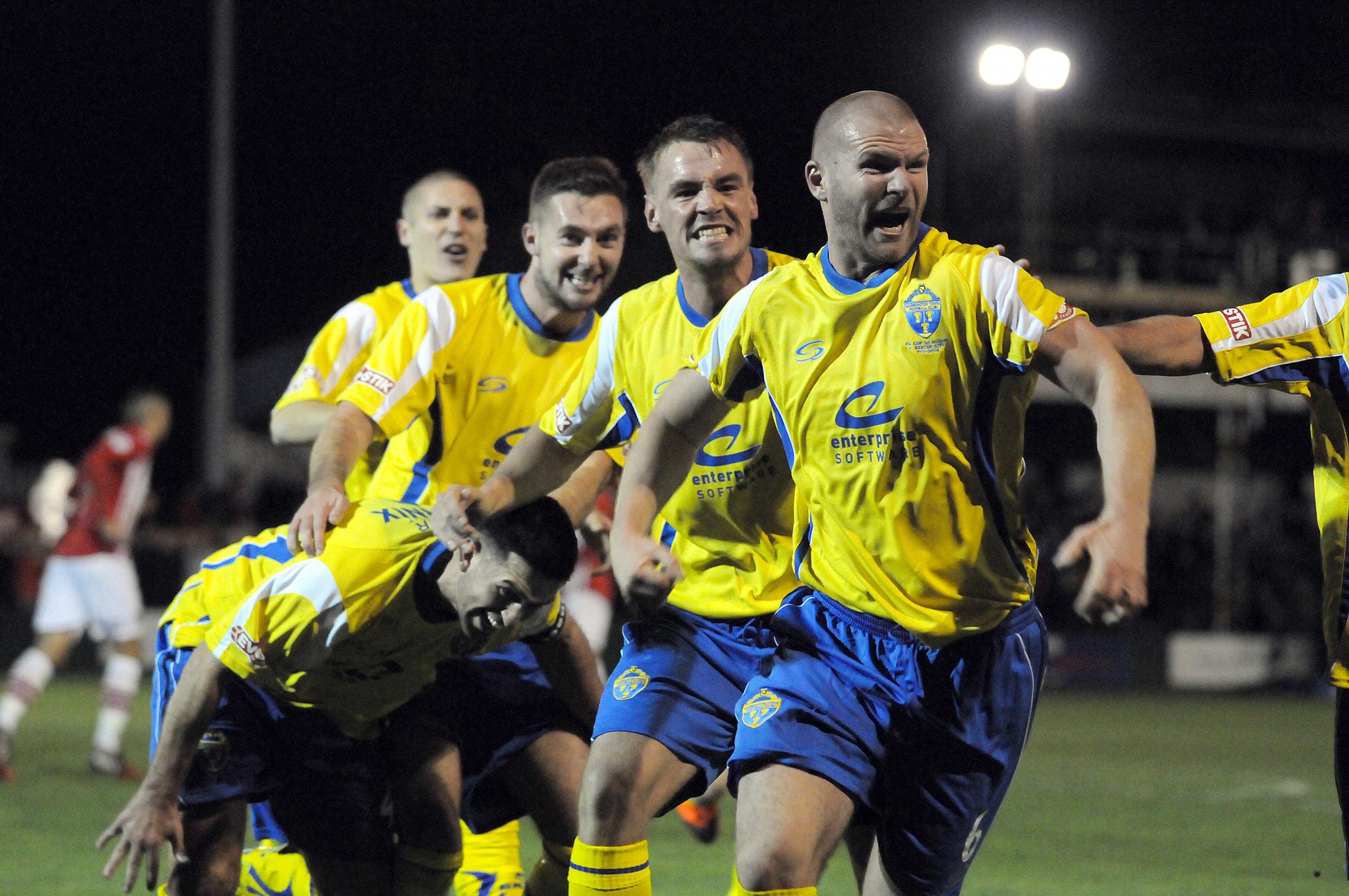 n 2014 > Goal celebrations for Warrington Town as they beat Exeter City in the FA Cup at Cantilever Park