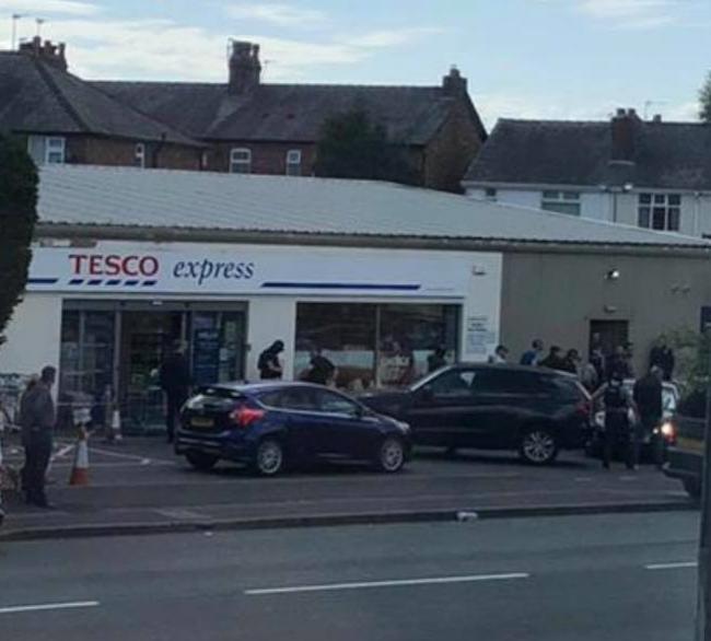 Armed police at the scene of Brazendale's arrest at Tesco Express in Grappenhall