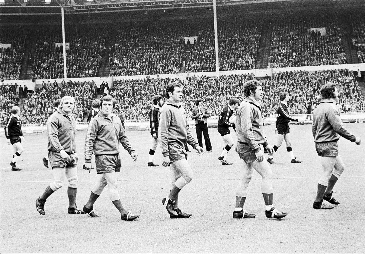 Barry Philbin, middle, walks out with Wire teammates Mike Nicholas, Frank Reynolds and Tommy Martyn for the 1975 Challenge Cup Final