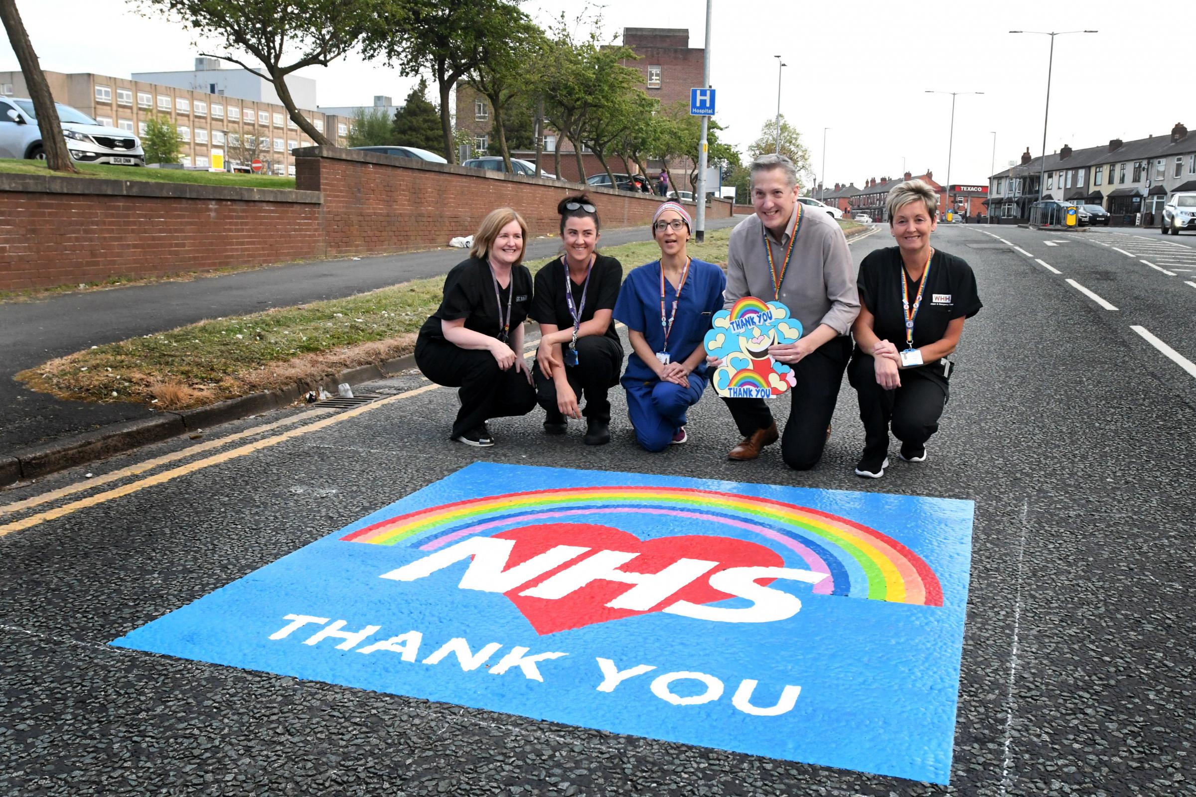 A road sign thanking NHS staff on Lovely Lane outside Warrington Hospital