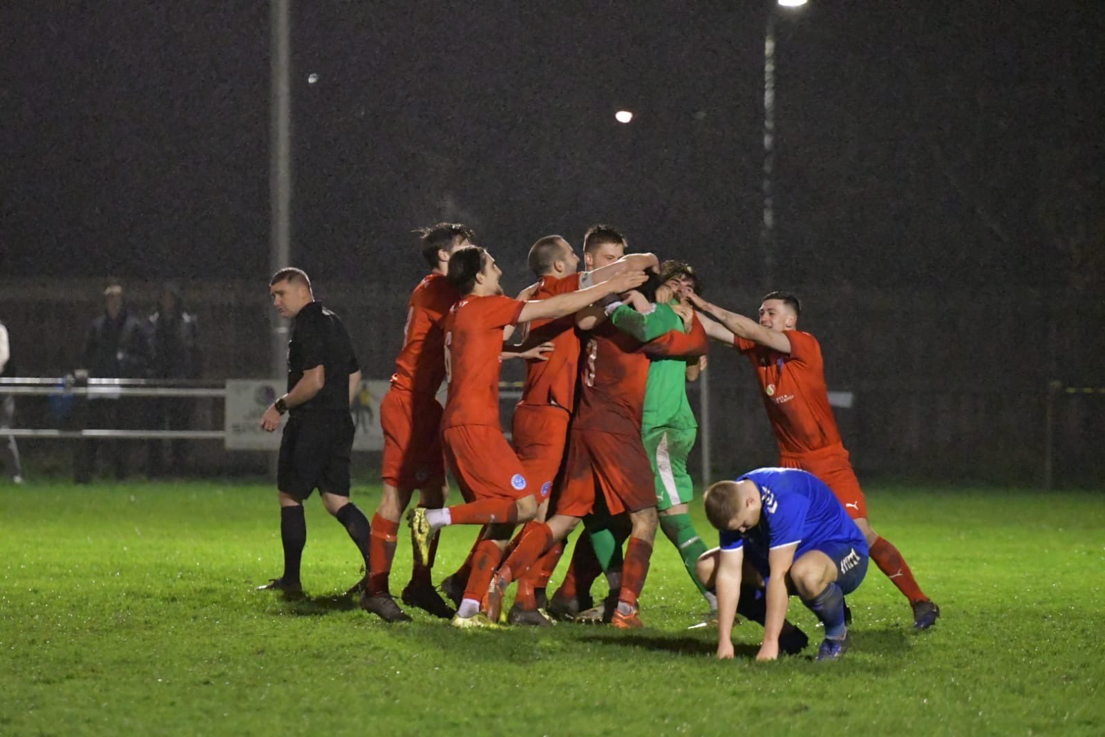 Keeper Graeme McCall is mobbed after saving the decisive penalty in the FA Vase penalty shoot-out win at Jarrow. Picture by Mark Percy