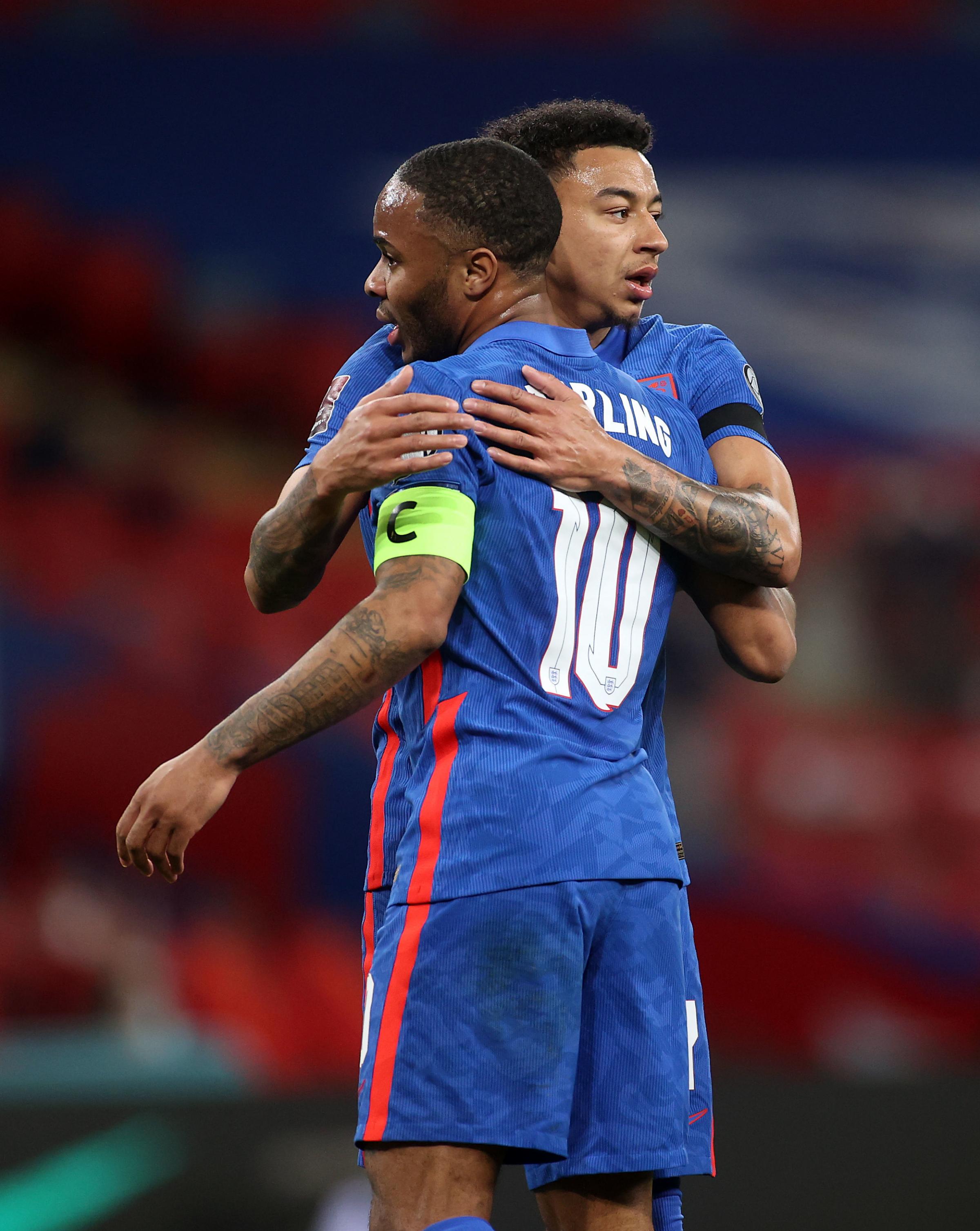 Lingard congratulates Raheem Sterling, who scored Englands third goal. Picture by PA Wire