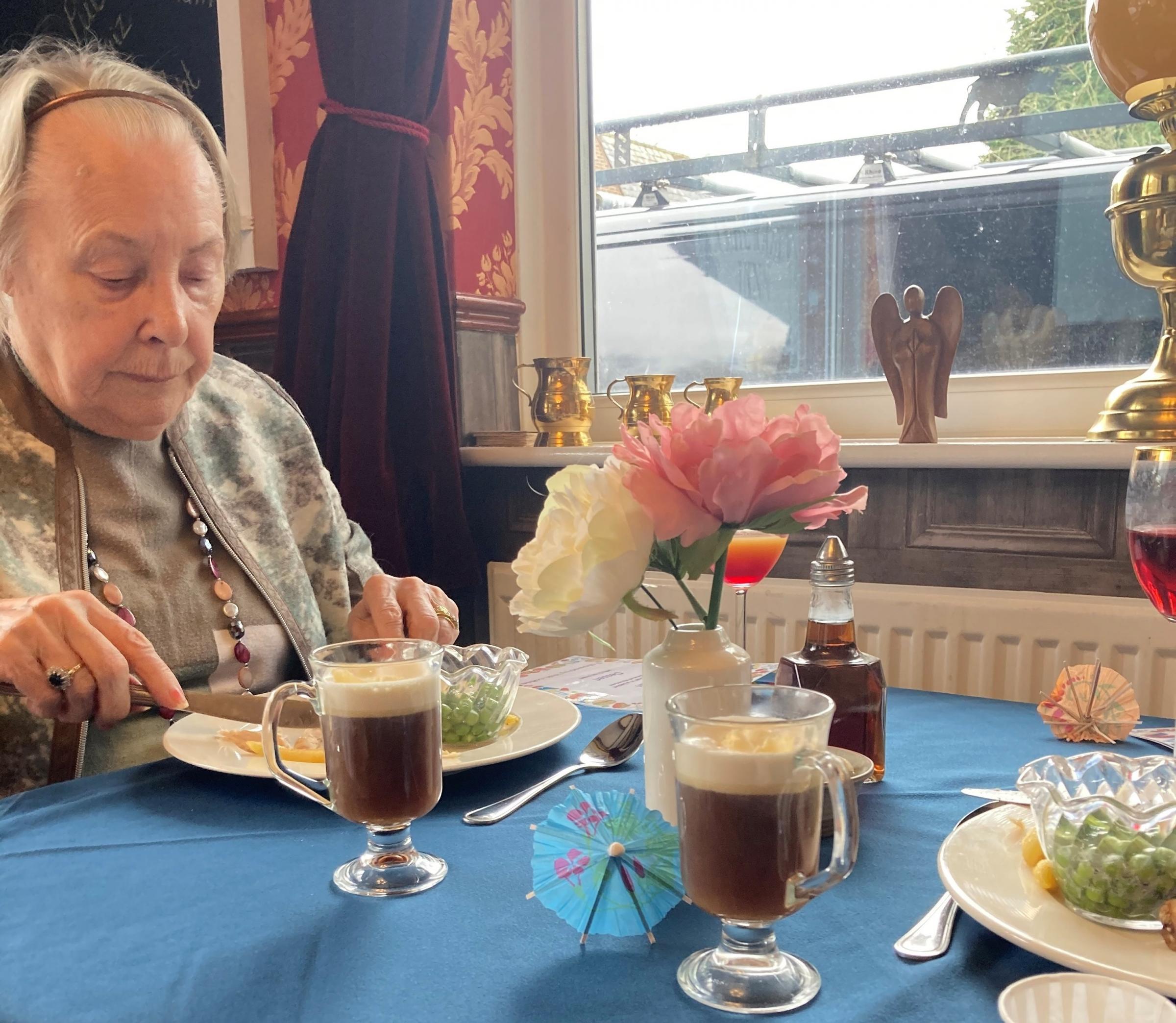 Elderly residents enjoy their pub dinner at St Oswalds House Care Home in Winwick