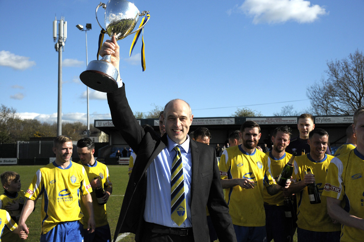 Chairman Toby Macormac holds the trophy aloft. Picture by Mike Boden