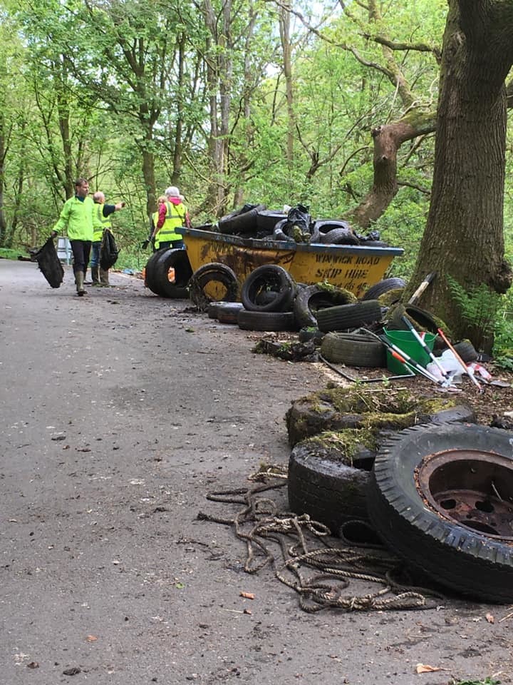 Volunteers fill two skips with 83 fly-tipped tyres and other bulky rubbish in Winwick (Images: Bob Towers)