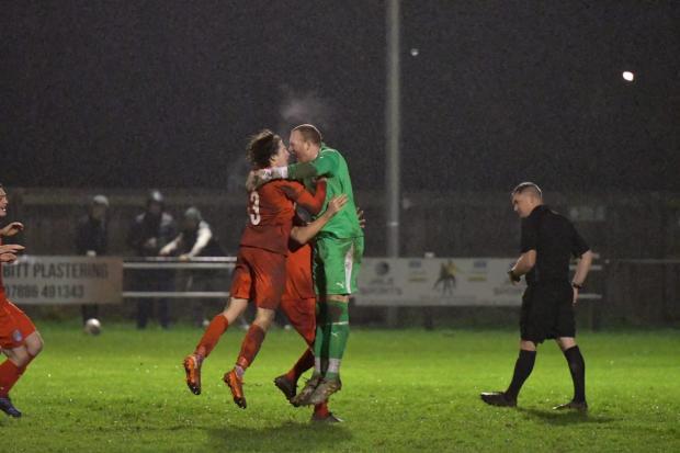 Graeme McCall is mobbed by teammates after the penalty shoot-out win over Jarrow. Picture by Mark Percy