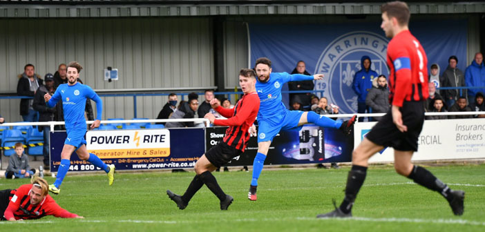 Paul Shanley hammers home one of his two goals against Goole. Picture by Mark Percy