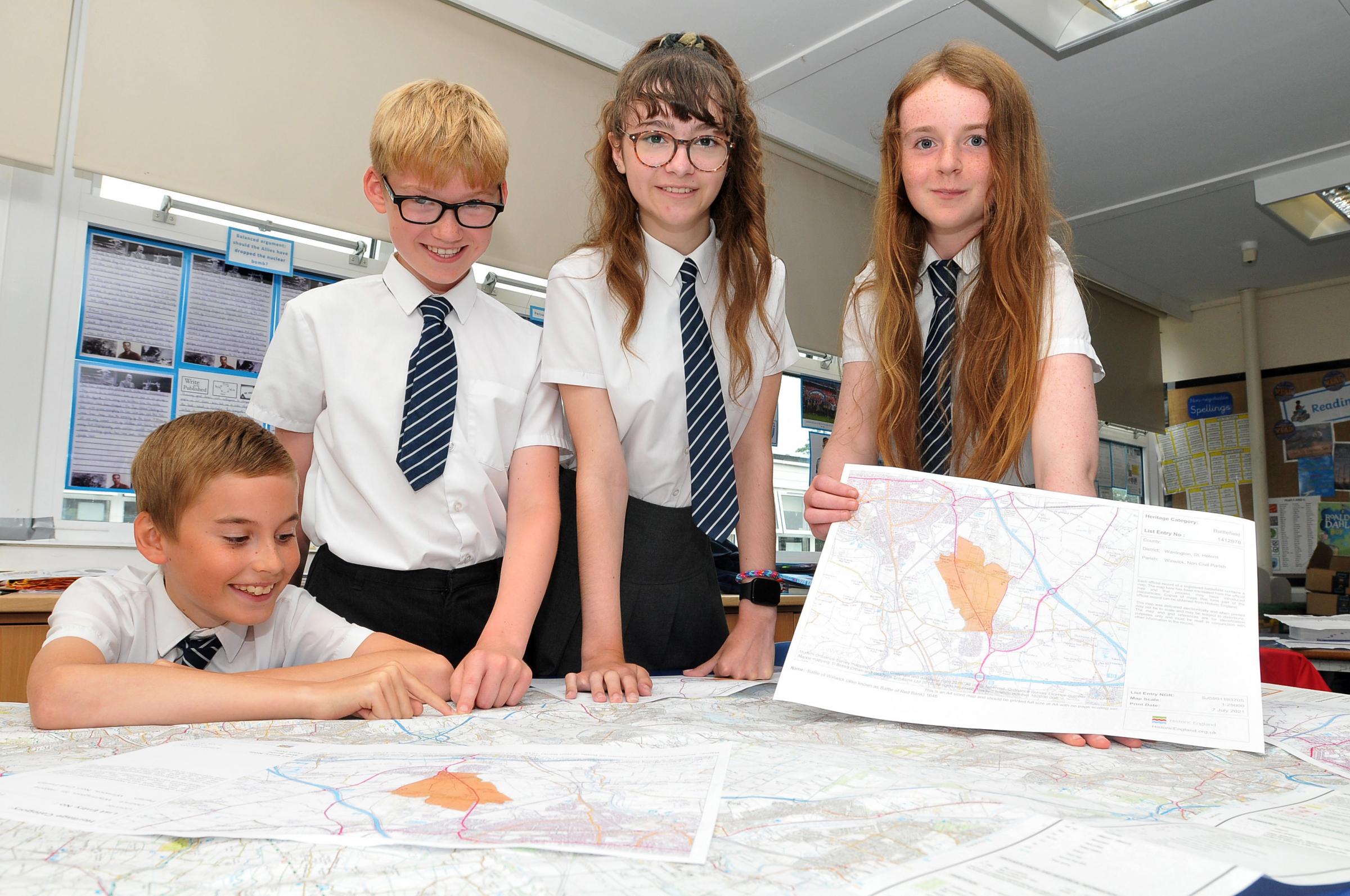 Bruche Primary School pupils Jack Shields, Lewis Chorley, Evie Brookes and Hannah Kearney hope to preserve the site of the Battle of Winwick against future development
