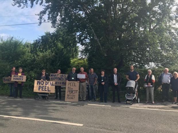 Warrington Guardian: The group protesting by the Warburton toll about the proposed price increase