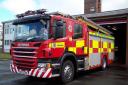 Crews rush to fire in block of flats on busy road in Warrington