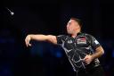 He won the PDC World Darts Championship at the Alexandra Palace in January 2021 but who is he? See question 14. Picture: PA