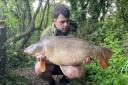 James Lavelle with his 22lb mirror carp caught at Rixton Claypits