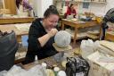 Ceramicist, Kerry Mellor,  at work on one of her exhibition pieces