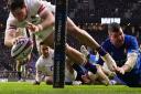 Alex Mitchell on the grass in the background after providing the pass for this try by Henry Arundell in England's win against Italy last time out
