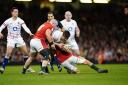 Alex Mitchell, left, supporting his England teammate Ben Curry during the 20-10 win against Wales in the Guinness Six Nations at the Principality Stadium. Picture: PA Wire