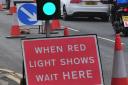 Long rush hour queues form near town due to temporary traffic lights