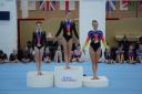 Two of the girls from Urban Gymnastics, Lily Heath Maskill and Lacey Willington, in gold and silver medal positions on the podium.