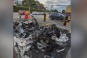 The burnt out vehicle at Newton-le-Willows Health and Fitness centre