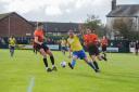 Josh Amis takes on the Peterborough Sports defence during Warrington Town's 1-0 defeat on Saturday