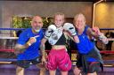 Daisy Sumpton with her stepdad Darren Collins and mum Gemma Collins, who are her coaches and co-owners of Warrior Muay Thai in Latchford