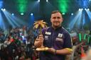 Luke Littler and his Palm Tree Trophy in Bahrain