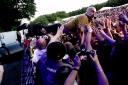 Tim Booth during his stage dive. Picture: Matt Sayle