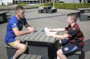 Ben Currie in conversation with 13-year-old Isaac Williams. Picture by Mike Boden