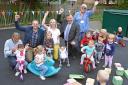Alex Cain, York’s UFO head of programme delivery, Helen Fletcher,  marketing manager at York’s UFO, Cllr Andrew Waller, and Jean Forrester, treasurer at Foxwood Community Centre, with parents and children in the new play area at Foxwood Community Cen