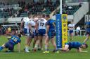 Warrington Wolves' academy players celebrate one of their tries against Wakefield Trinity
