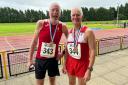 Dave Gill and Dave Watson with their medals from the British Masters 10,000m Track Championships