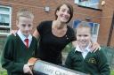 Pupils Alfie Hands and Kathryn Kendrick with head teacher Michelle Dobson MBA080615A
