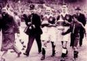 Freddie Worrall holding the base of the FA Cup in Portsmouth's 1939 win at Wembley