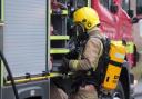 Firefighters put out sofa fire in Burtonwood using a hose reel jet