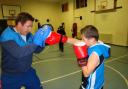 Mark Simmons, left, at training with Phoenix Fire Boxing Club