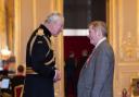 Tommy Spedding met the King during a ceremony where he received an OBE