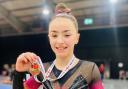 Ruby Cox, 12, with her bronze medal from the English Championships