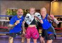 Daisy Sumpton with her stepdad Darren Collins and mum Gemma Collins, who are her coaches and co-owners of Warrior Muay Thai in Latchford