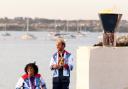 Niki Birrell picks up his medal in Weymouth with Alexandra Rickham