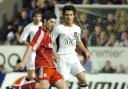 Liverpool's Xabi Alonso and United's Rodrigo Possebon in last year's clash at The Halliwell Jones