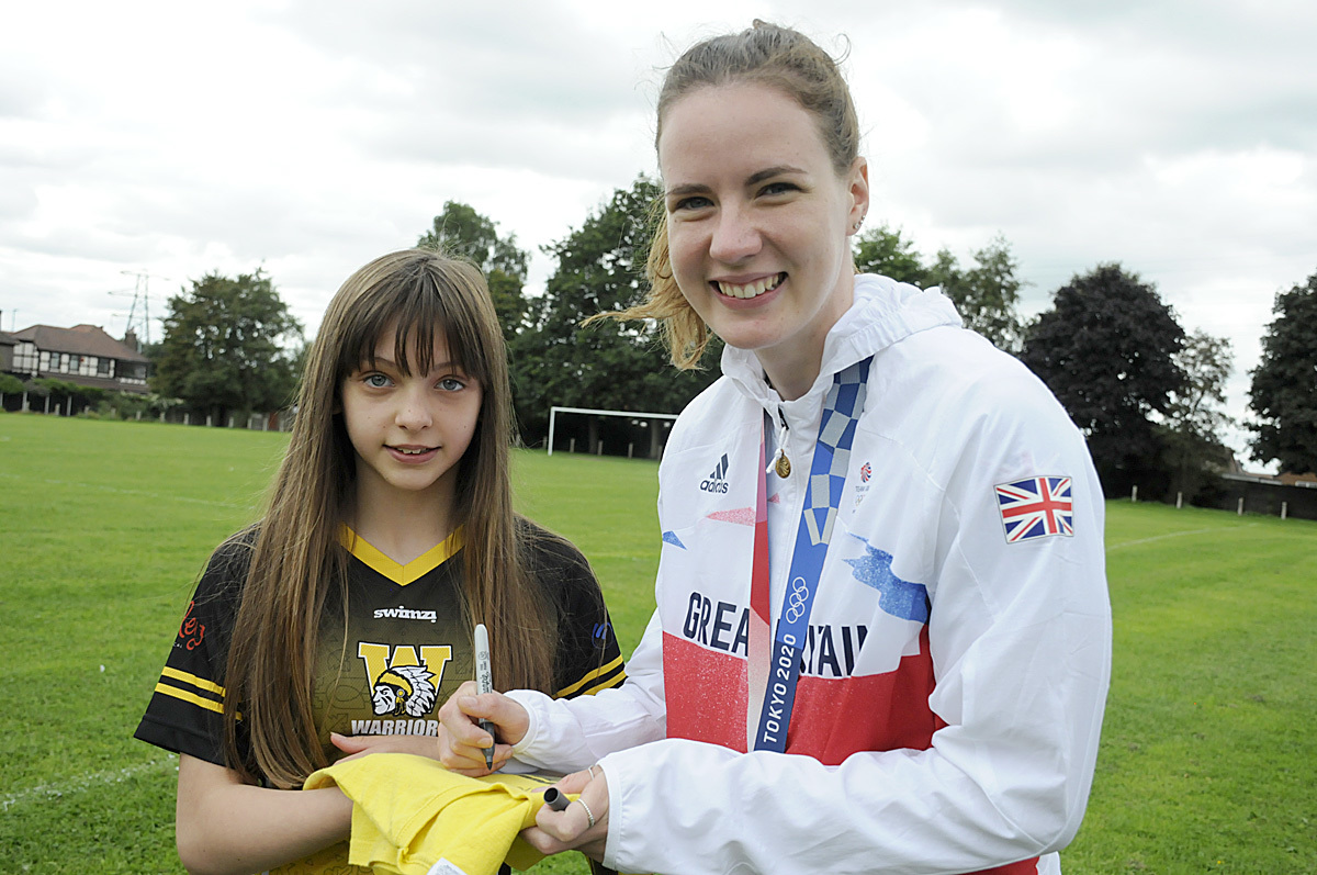 Kathleen signs an autograph for Warriors swimmer Rosie Barker-Mayer (Image: Mike Boden)