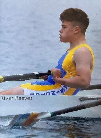Quinlan rowing in the boat on its first outing at the club when he was 14 with River’s name on the side of the boat next to him