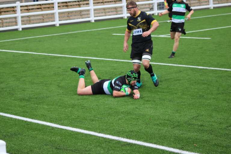 Rob Makin scores one of his two tries against Burnage. Picture by Tim Martin