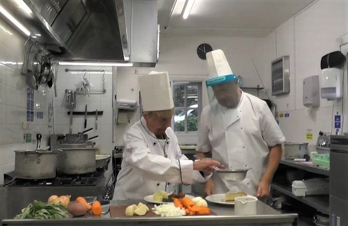 Resident Nora Gilliver and chef Wayne Woolman busy in the kitchen preparing dishes to celebrate British Food Fortnight