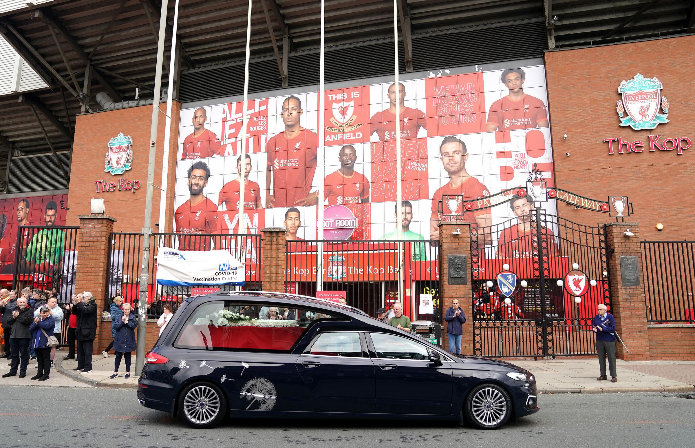 Fans gather outside Anfield to bid a final farewell to Roger Hunt. Pictures by Mike Egerton/PA Wire